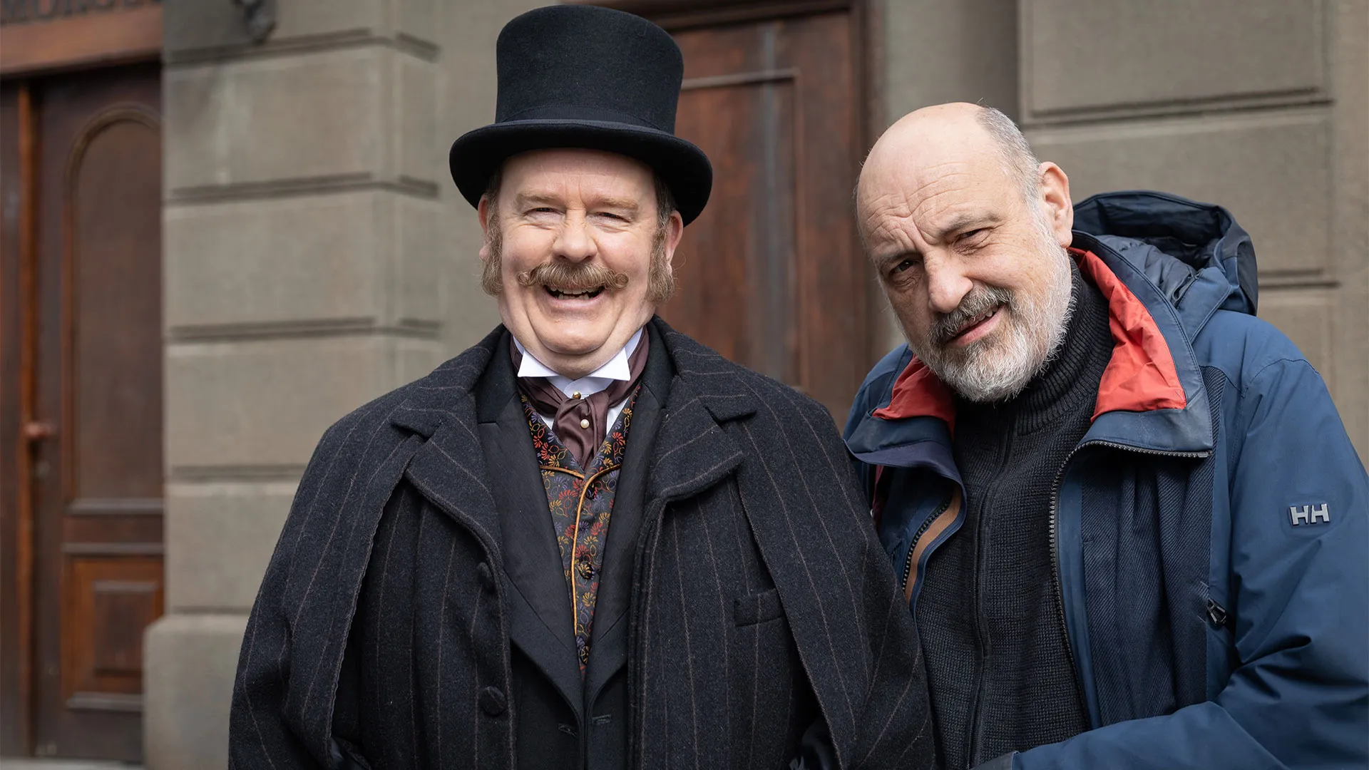 Simon Ludders as Mr. Potts smiling behind the scenes in Miss Scarlet Season 6