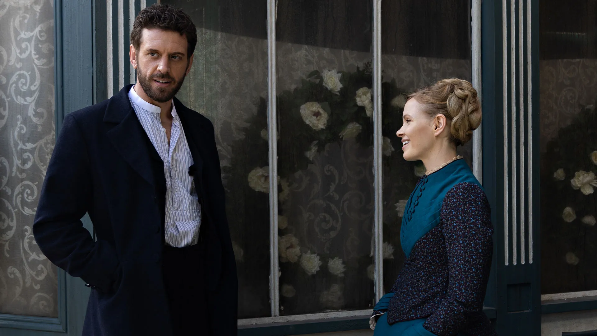 Tom Durant-Pritchard as Inspector Blake and Kate Phillips as Eliza Scarlet smiling behind the scenes of Miss Scarlet Season 6