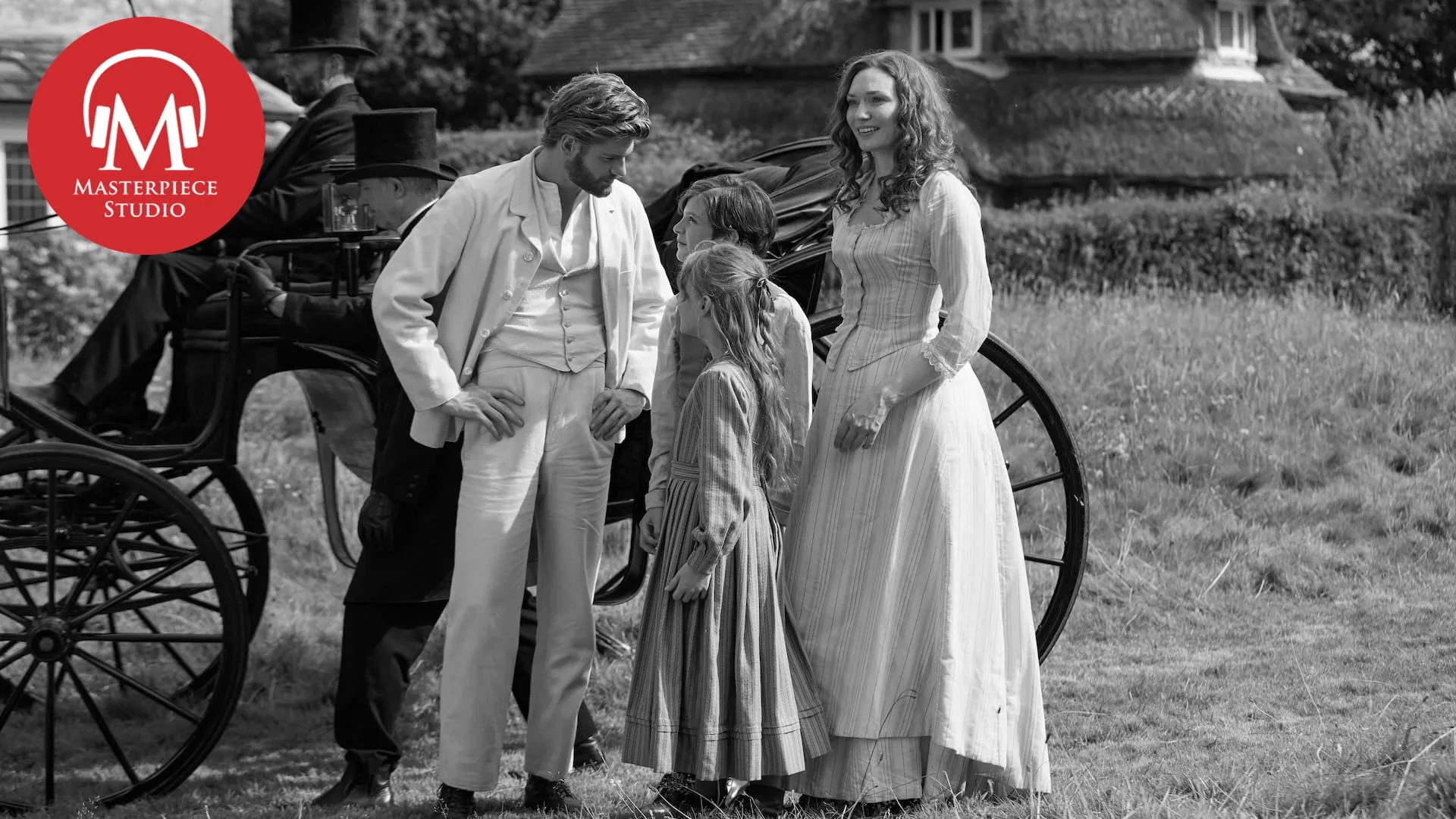 black and white photograph of actor danny griffin as jolyon forsyte with eleanor tomlinson as louisa byrne, their children outside their new home in the country with the red and white mp studio logo