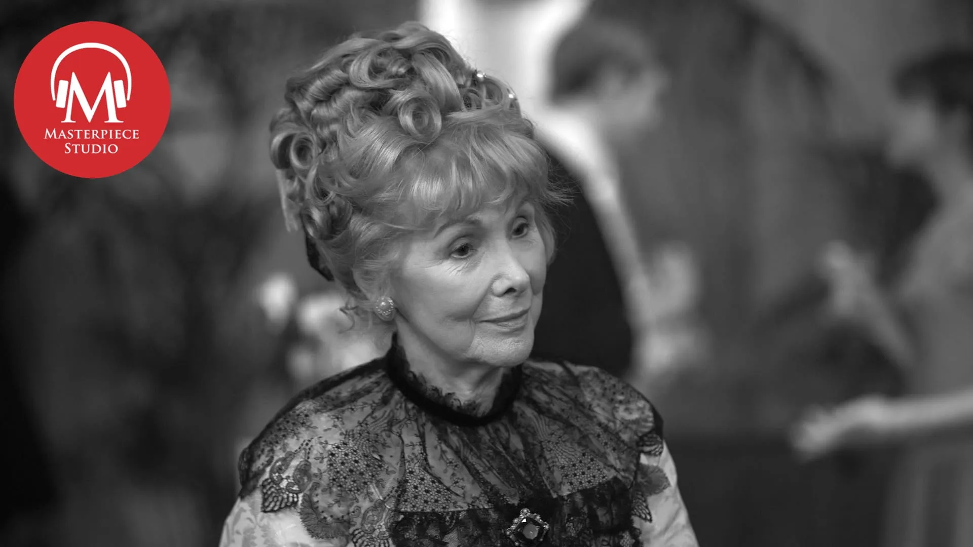 black and white photo of actor susan hampshire as lady carteret with the red masterpiece studio logo in the top left