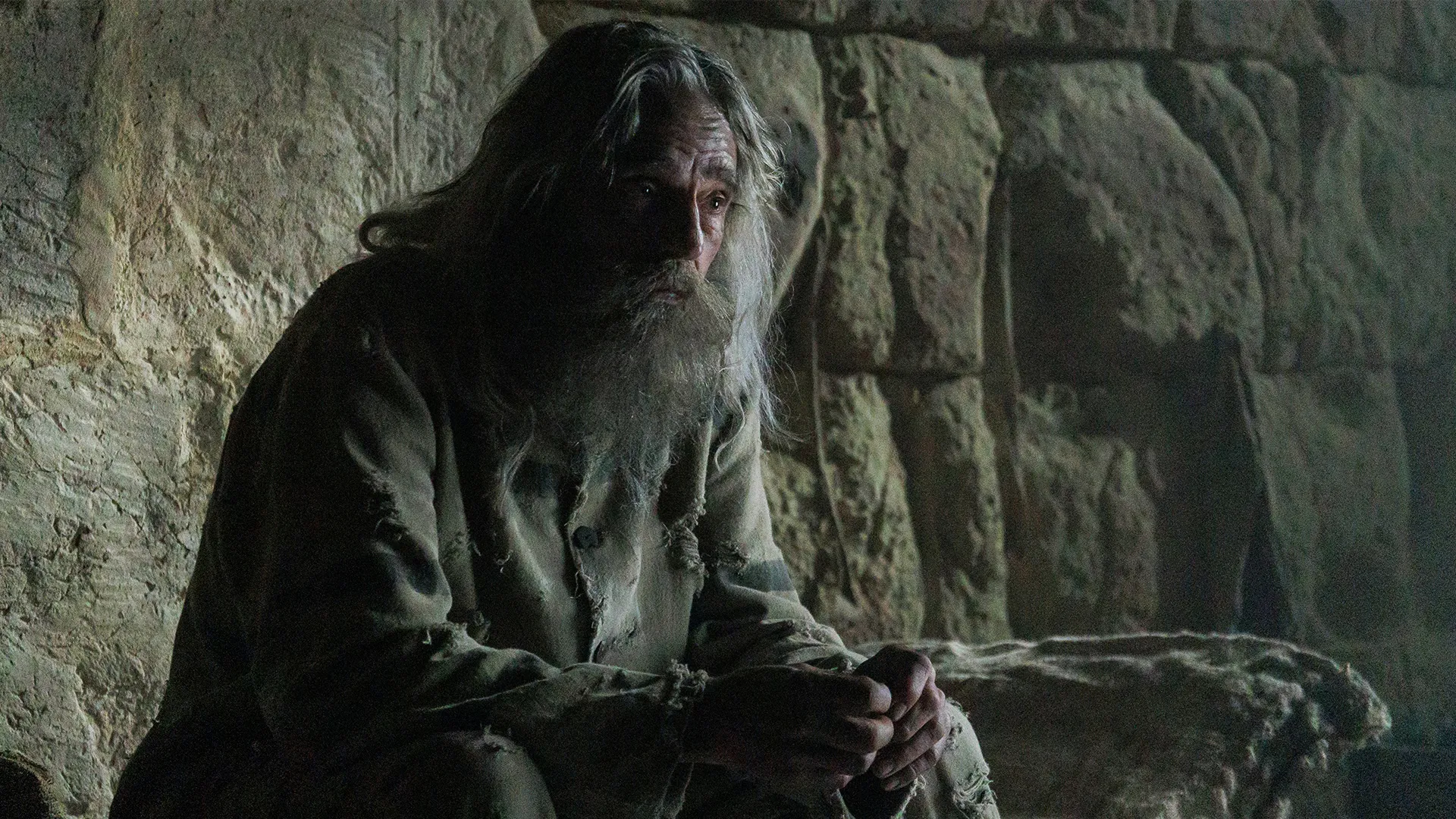 Jeremy Irons as Abbe Faria in a prison cell in The Count of Monte Cristo on MASTERPIECE on PBS.