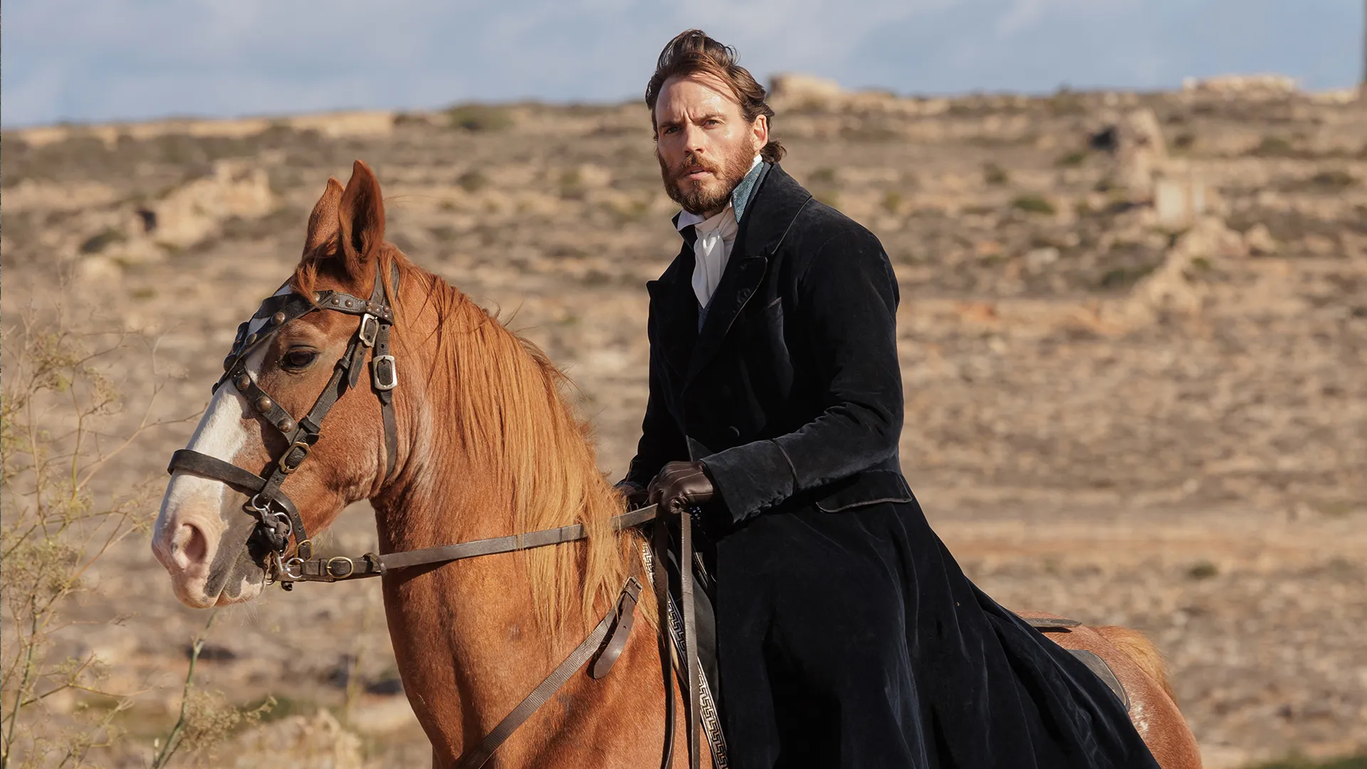 Sam Claflin as Edmond Dantes, riding a horse in The Count of Monte Cristo on MASTERPIECE on PBS.
