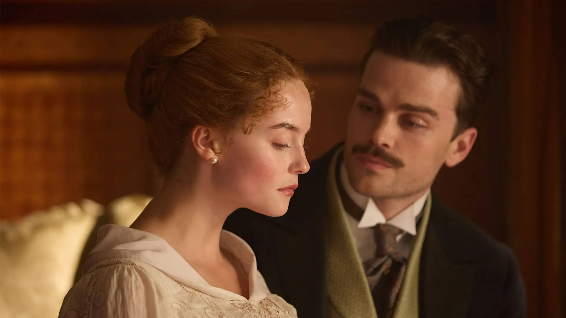 An intimate moment with Soames and Irene, she, in profile, looking sad, and he, gazing at her fixedly