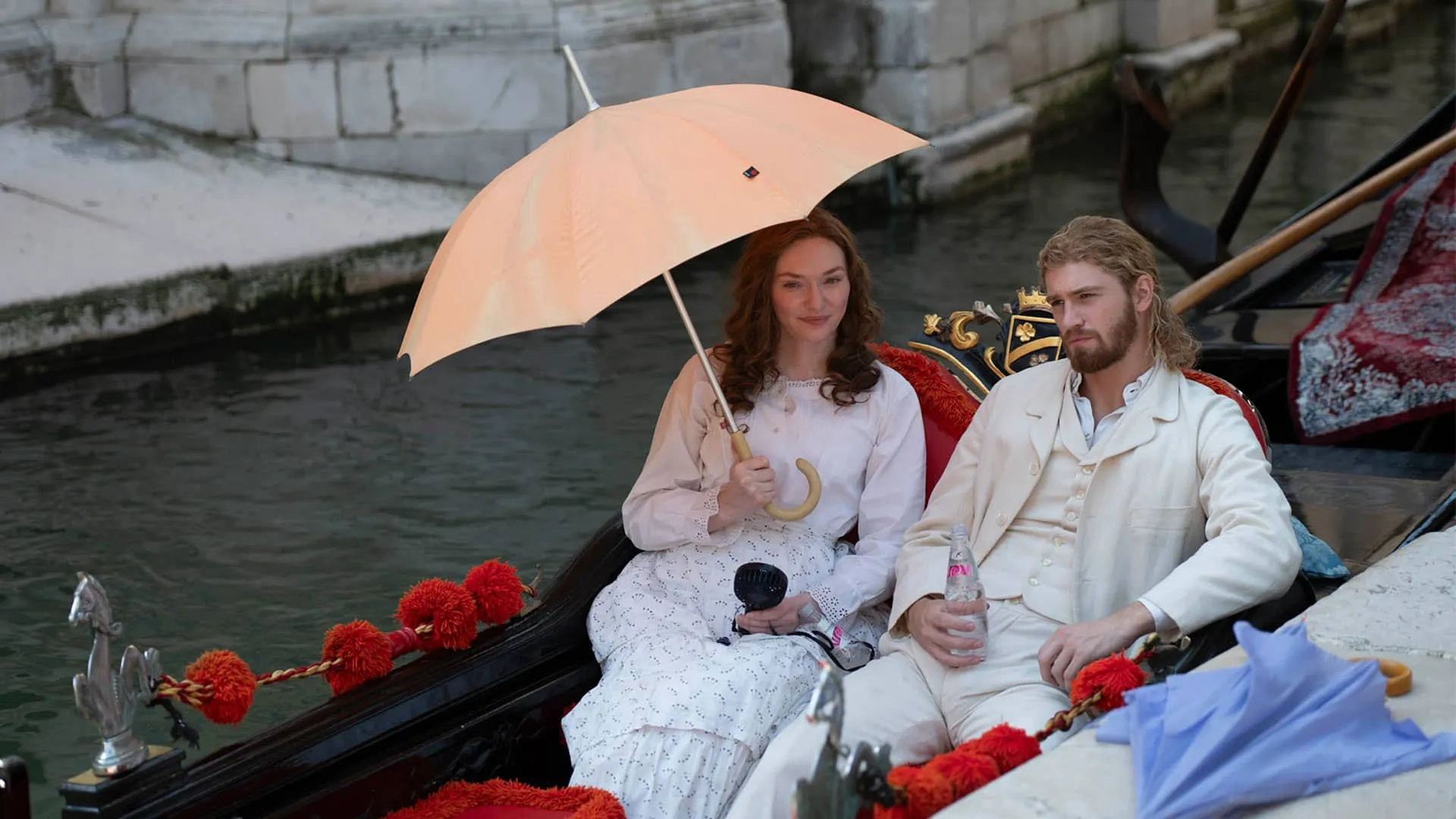 Actors Eleanor Tomlinson and Danny Griffin in a gondola in Venice between shots filming The Forsytes