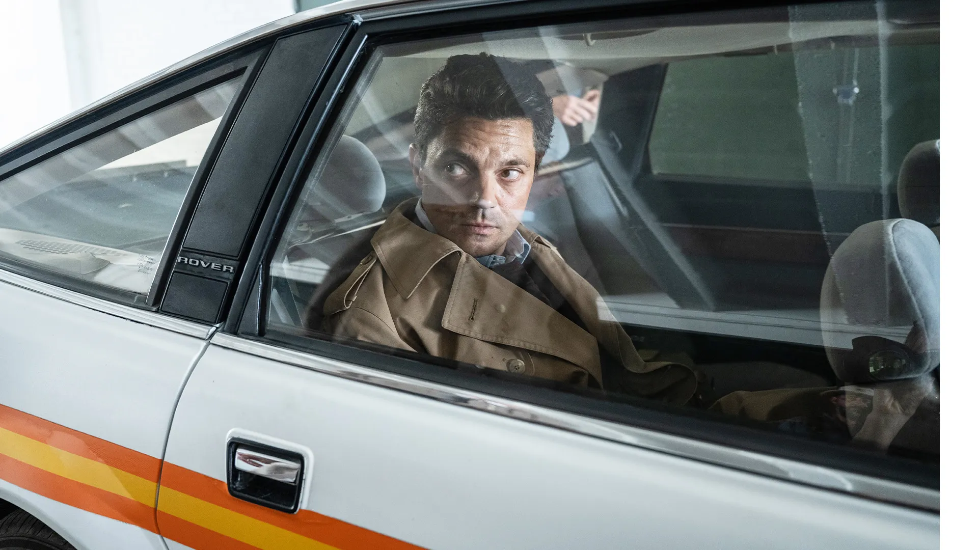 Actor Dominic Cooper portraying arrested lawyer Edwyn Cooper in a scene from The Gold Season 1.