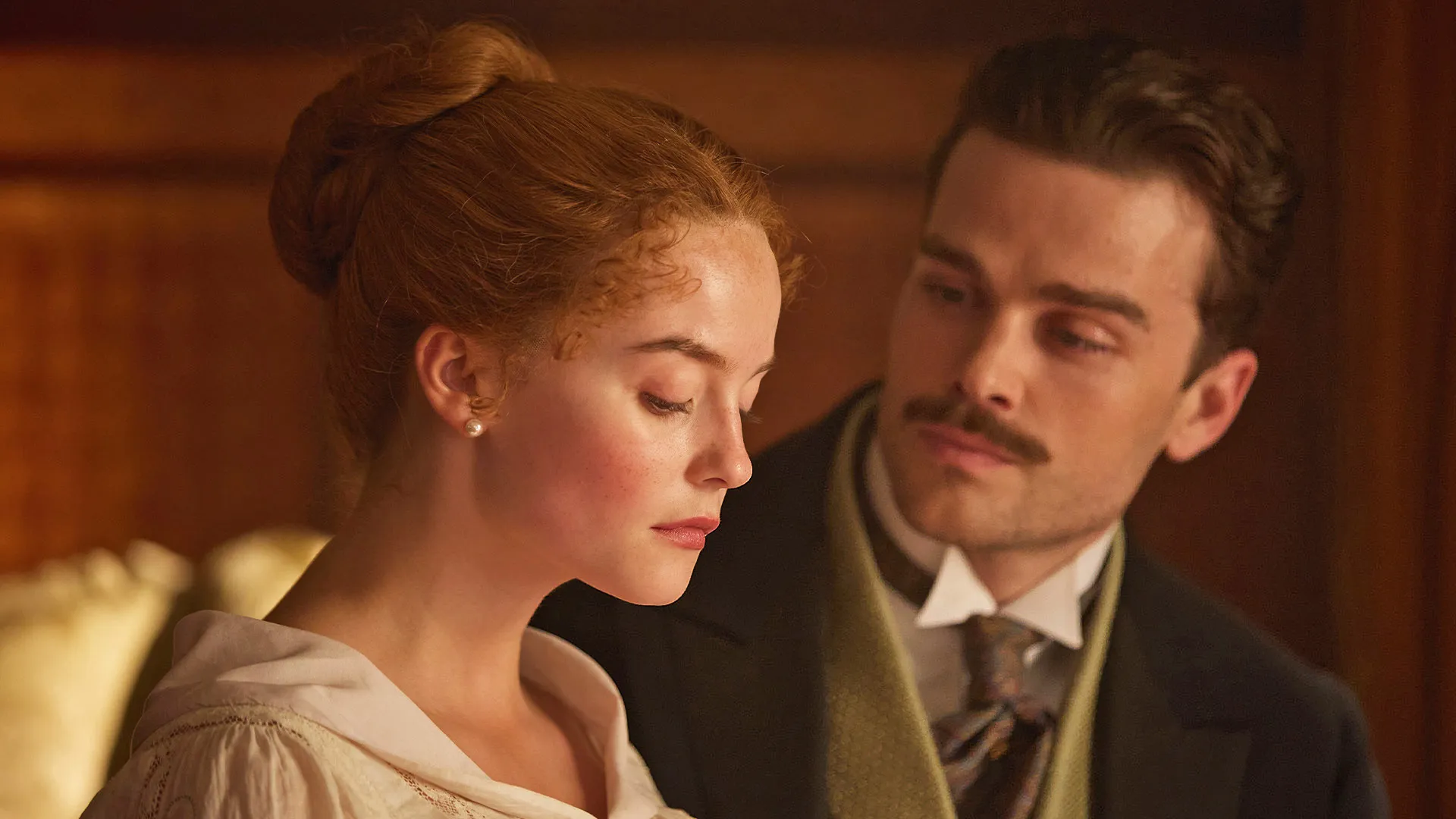 Actor Millie Gibson as Irene and Joshua Orpin as Soames Forsyte in a scene from season 1 of the Forsytes on PBS MASTERPIECE.