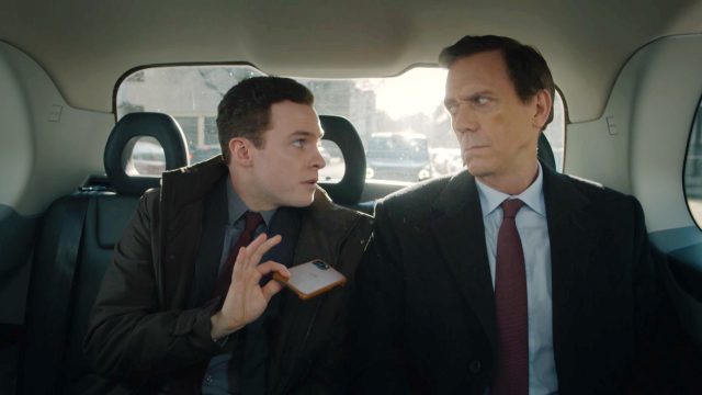 Iain De Caestecker and Hugh Laurie in Roadkill, Episode 1