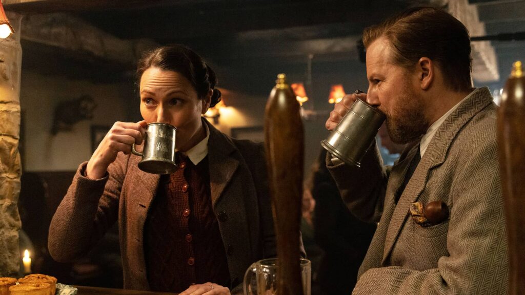 Mrs. Hall and Siegfried sharing a pint at the Drovers