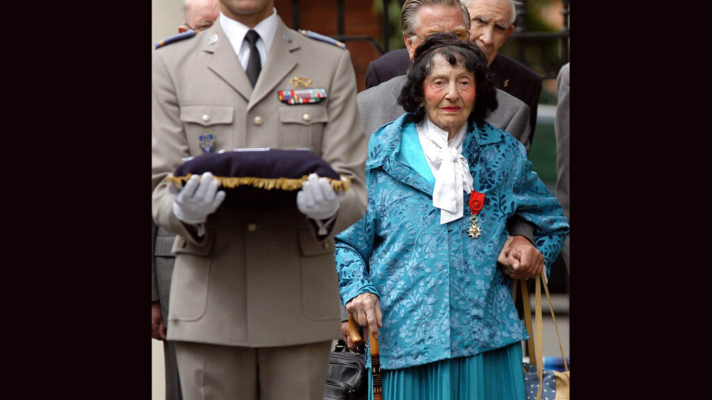 Photo of Andree Peel receiving France's Legion d'Honneur medal age age 99. She helped dozens of downed bomber pilots escape France during WW2.