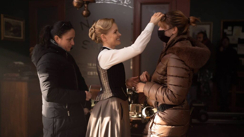 Kate Phillips and crew behind the scenes of Miss Scarlet and The Duke Season 4