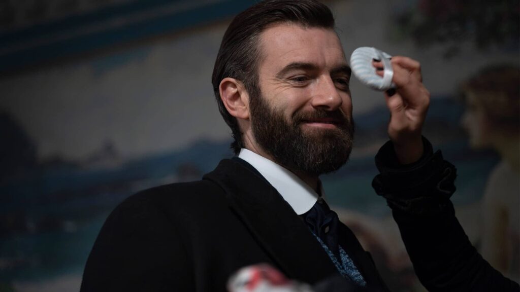 Stuart Martin getting a makeup touch-up behind the scenes of Miss Scarlet and The Duke Season 4