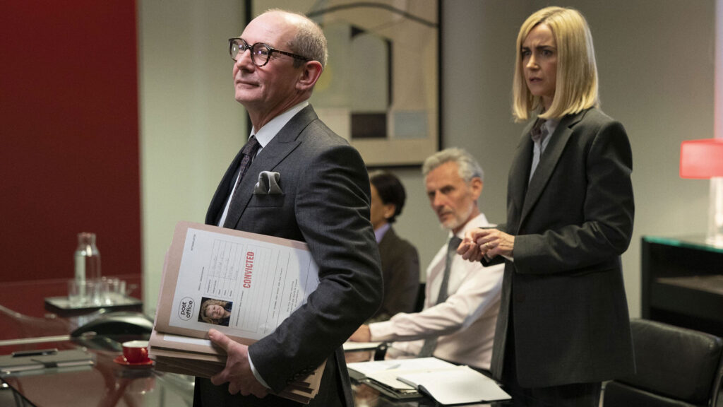 Actors Ian Hart as forensic accountant Bob Rutherford and Katherine Kelly as Angela van den Bogert in a scene from Mr Bates vs The Post Office on PBS MASTERPIECE.