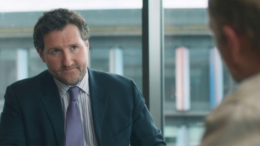 Actor John Hollingworth portraying contract lawyer James Hartley in a scene from Mr Bates vs The Post Office on PBS MASTERPIECE.