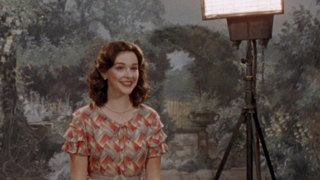Scene of young woman in colorful dress being filmed for TV; a scene from the drama miniseries Nolly airing on PBS MASTERPIECE.