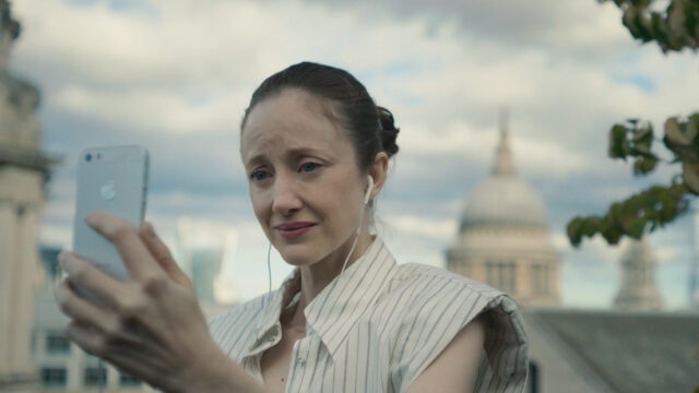 Andrea Riseborough as Alice holding a phone in Alice & Jack