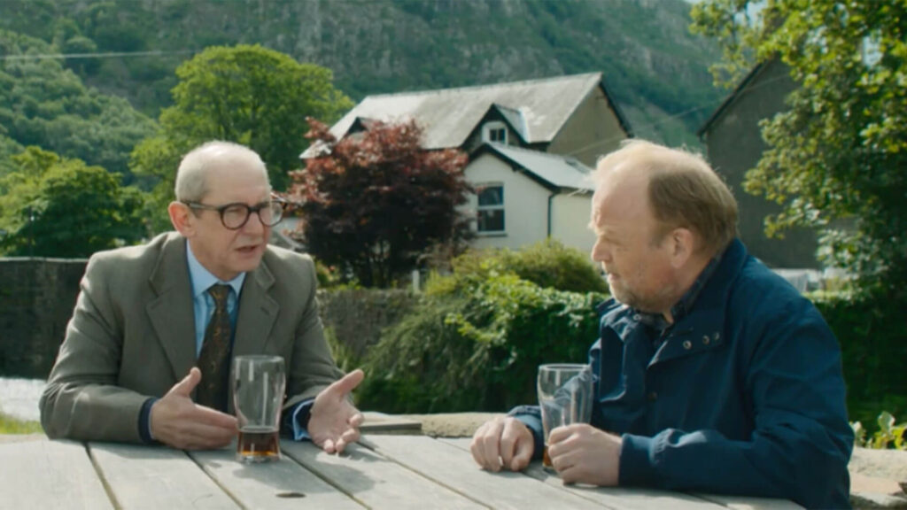 Actors Ian Hart (left) as Bob Rutherford and Toby Jones (right) as Alan Bates in a scene from Mr Bates vs The Post Office on PBS MASTERPIECE.