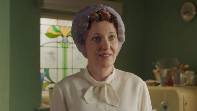 Kacey Ainsworth as Cathy Keating standing in the kitchen in Grantchester Season 9