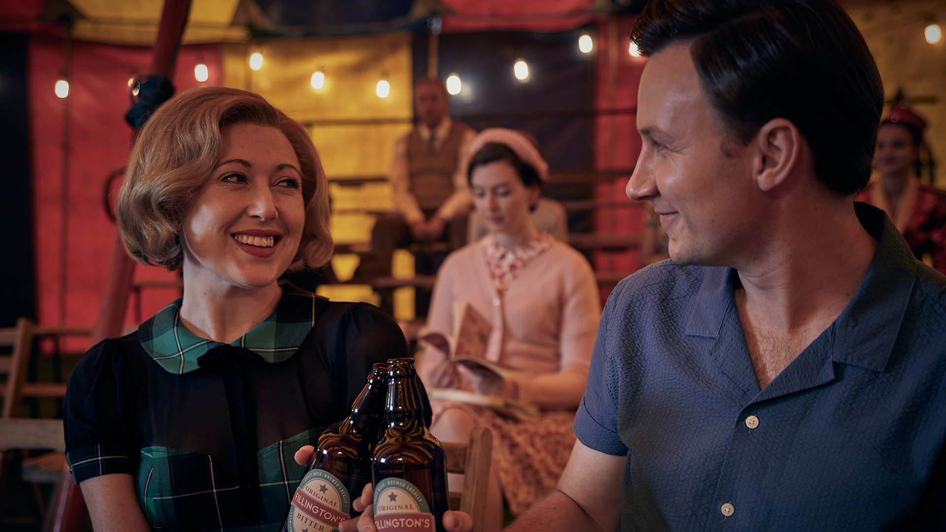 Melissa Johns as Miss Scott and Bradley Hall as Larry enjoying drinks together in Grantchester Season 9