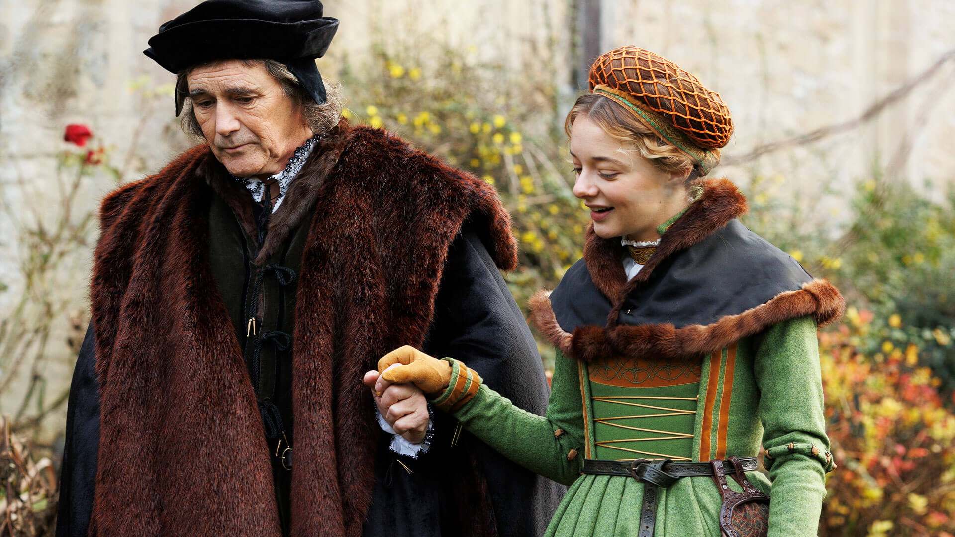 Color photo showing actors Mark Rylance and Ellie de Lange in costume as Sir Thomas Cromwell and his daughter Jenneke from Wolf Hall: The Mirror and the Light on PBS MASTERPIECE.