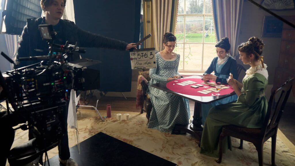 Synnøve Karlsen, Patsy Ferran, and Madeleine Walker prepare for a scene for Miss Austen