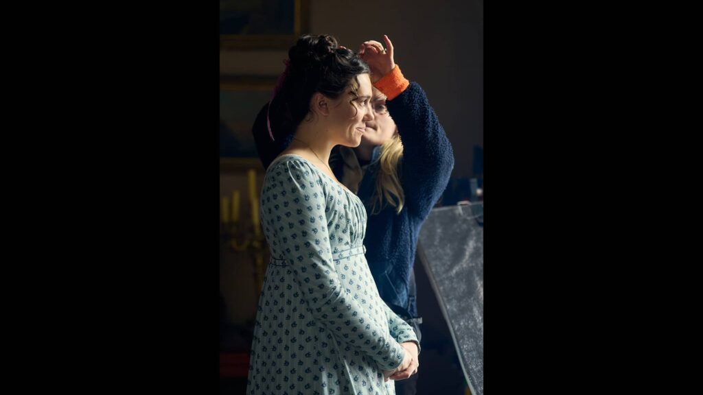 Synnøve Karlsen getting her hair touched up behind the scenes of Miss Austen