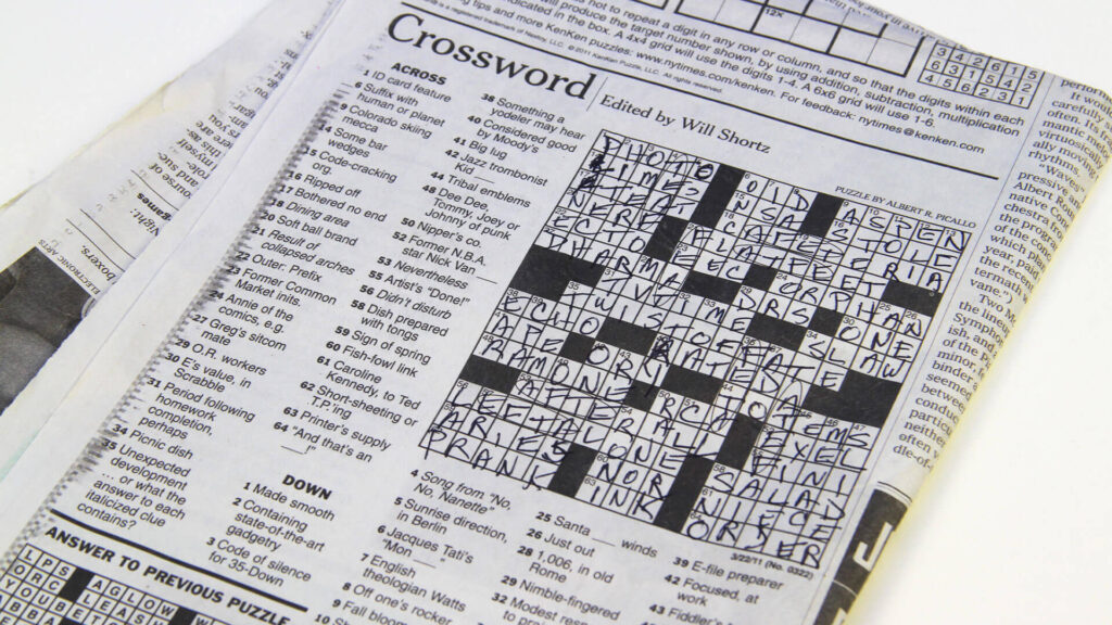 Photograph of The New York Times crossword edited by Will Shortz, which has been filled out completely.