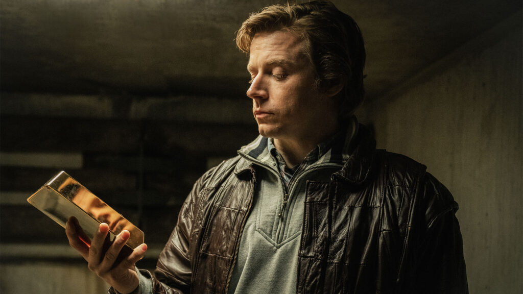 Photo of actor Jack Lowden in his role as gold fencer Kenneth Noye as seen in The Gold true-crime series on MASTERPIECE on PBS.
