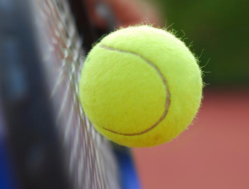 Tennis racquet with ball