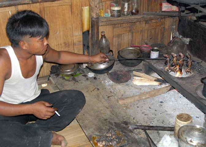 a Mizo villager prepares what he considers a gourmet meal.