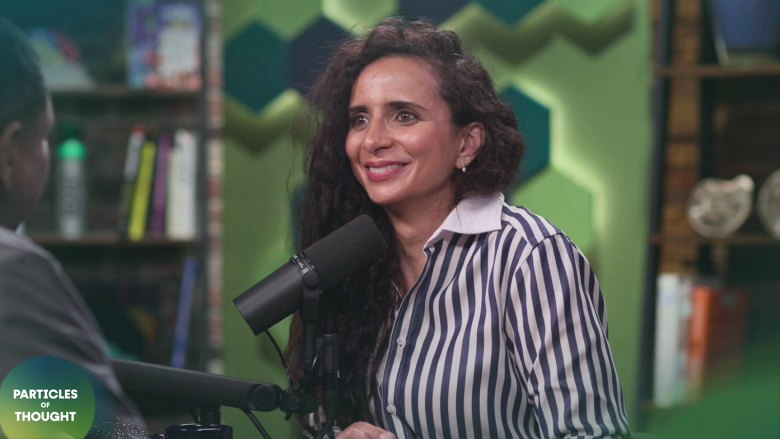 Photo of Ella Al Shamahi on the Particles of Thought podcast