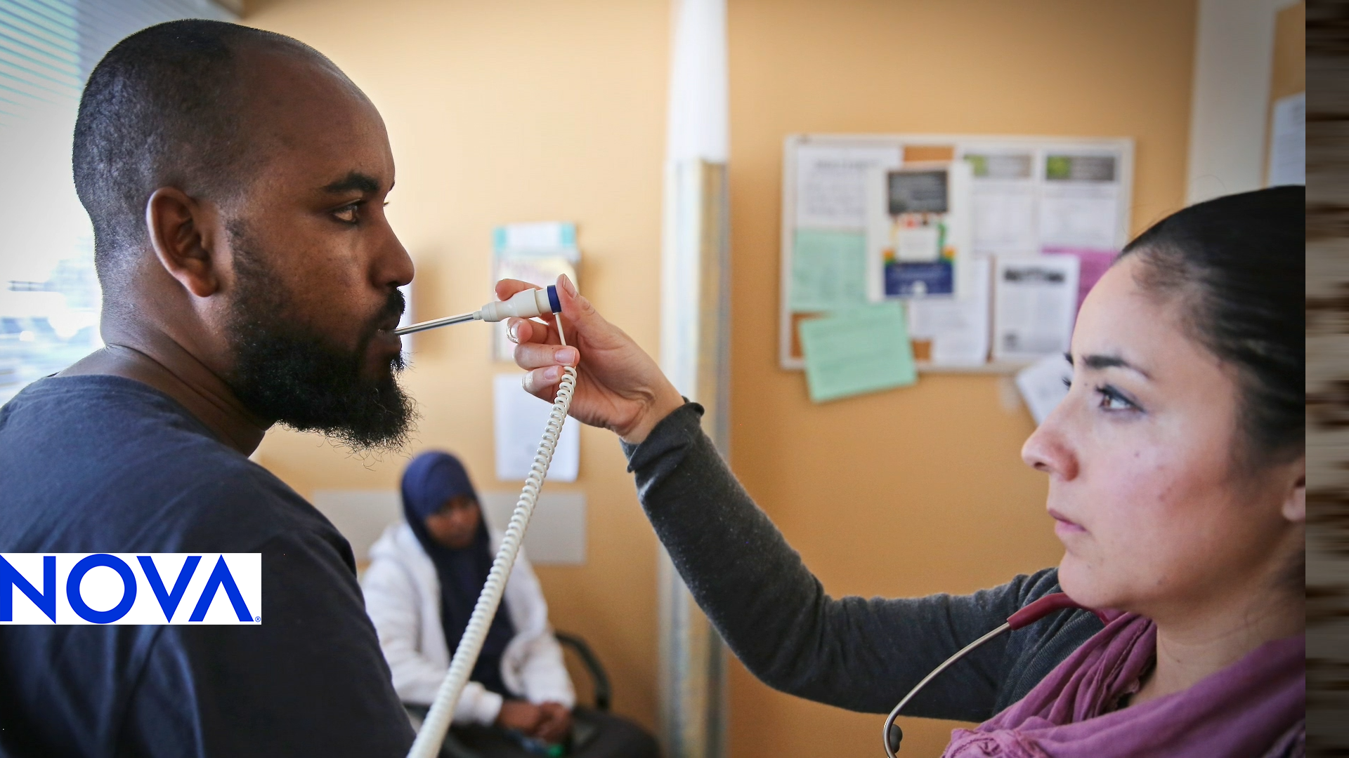 A nurse takes a man's temperature.
