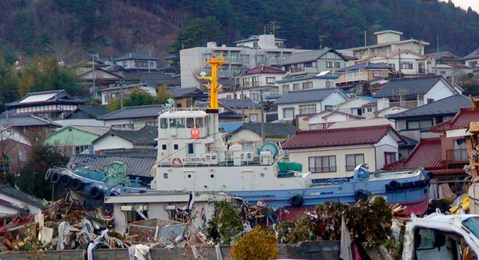 tugboat amidst buildings