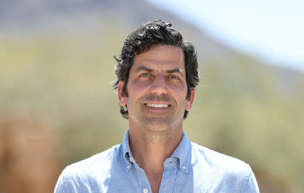 Color headshot photo of appraiser Mark Millea with mountain range in background