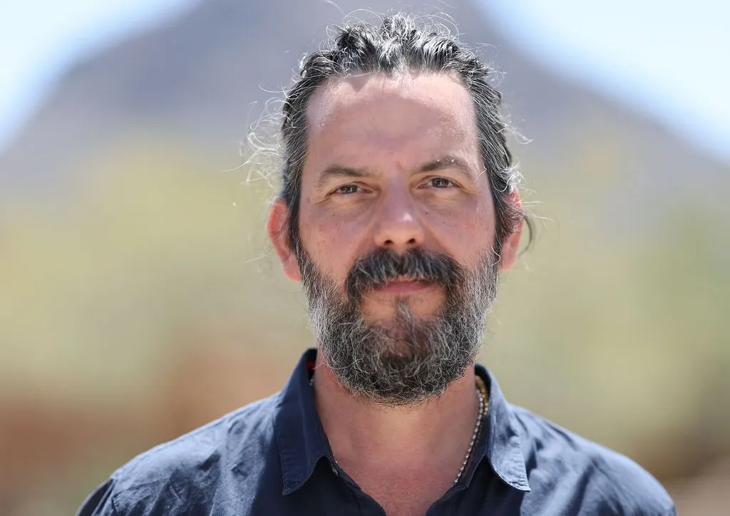 Color headshot photo of appraiser Michael Millea with mountain range in background