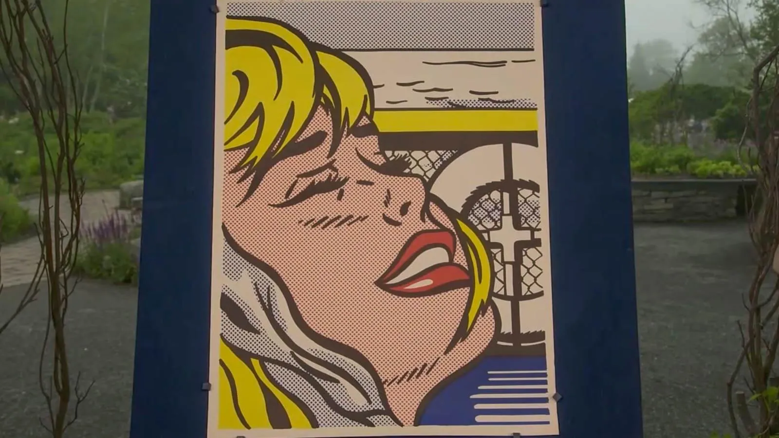 A pop art print of a blonde woman with red lips against a boat background.