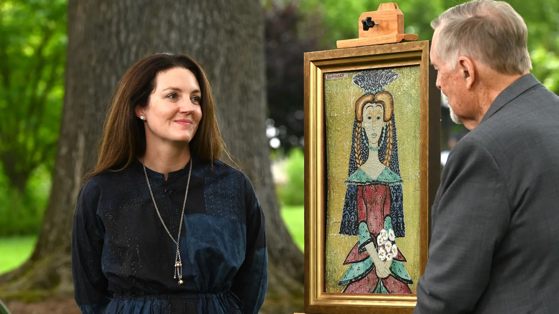 A photo of an appraisal of a ceramic tile depicting a women