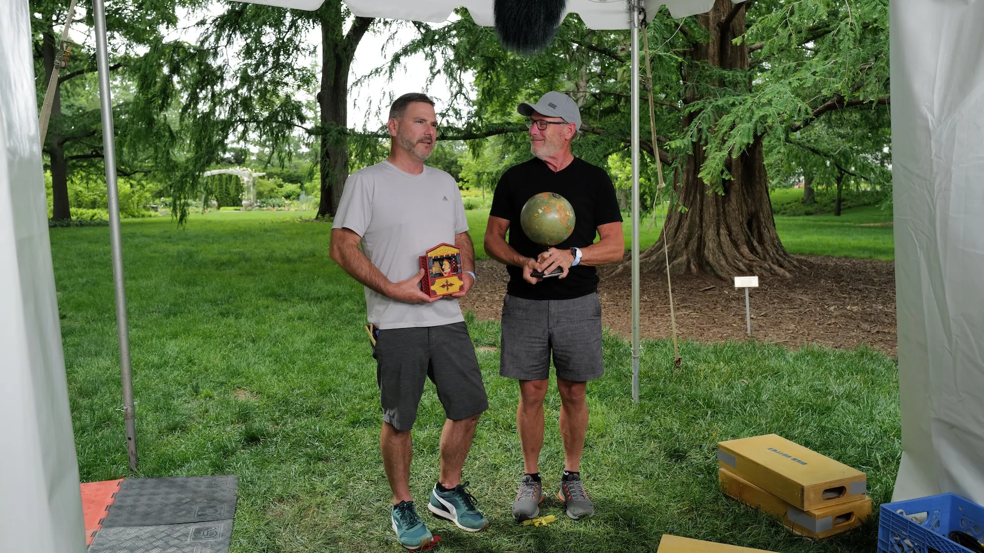 A photo of the Feedback Booth while two guests explain their objects