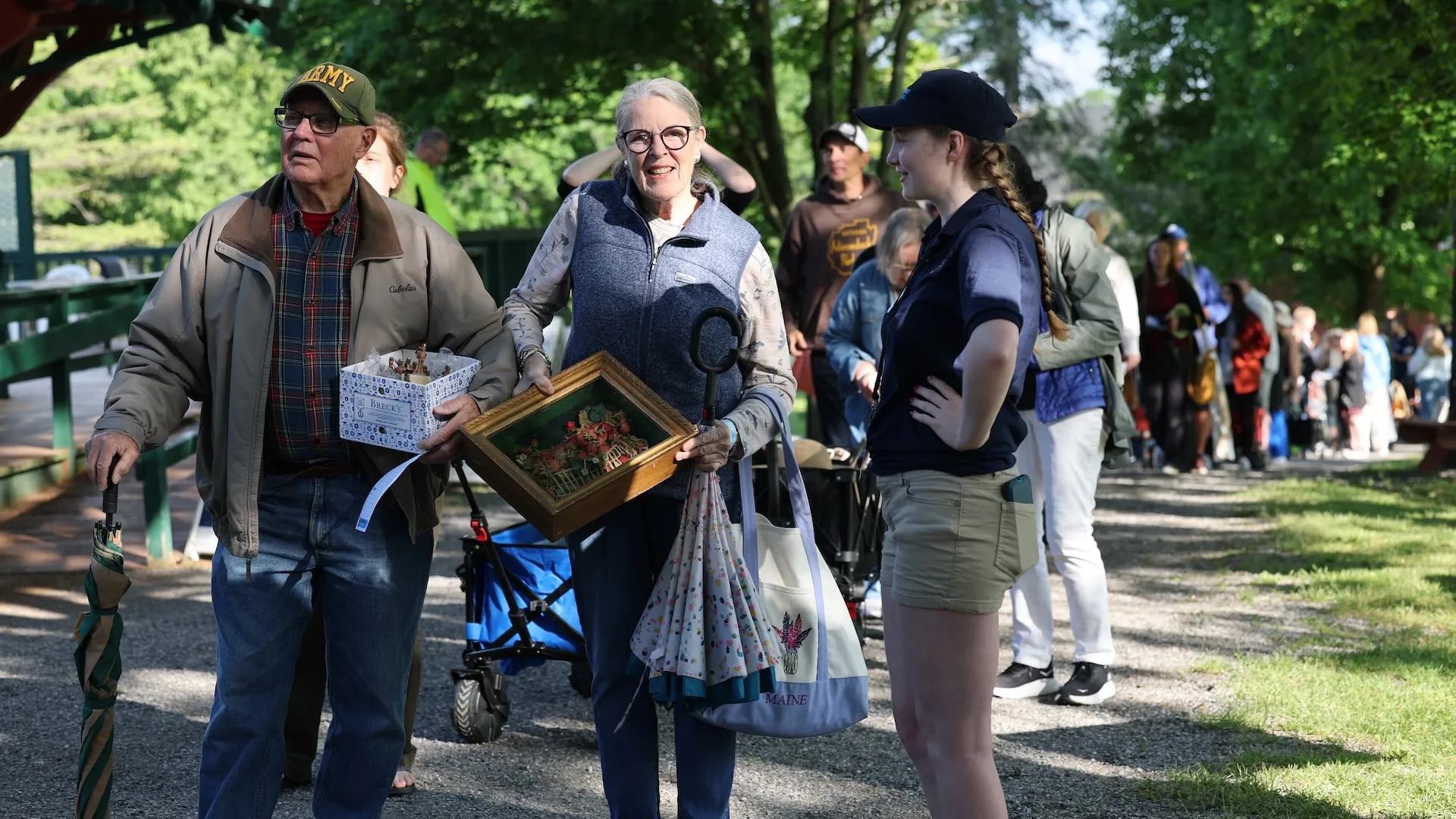 A photo of a volunteer talking to two guests