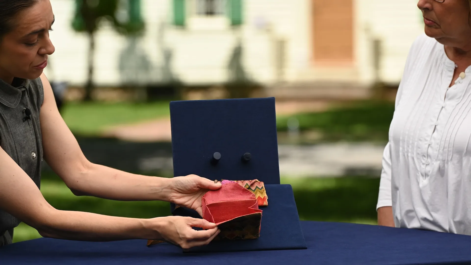 A photo of an appraisal of a needlepoint wallet