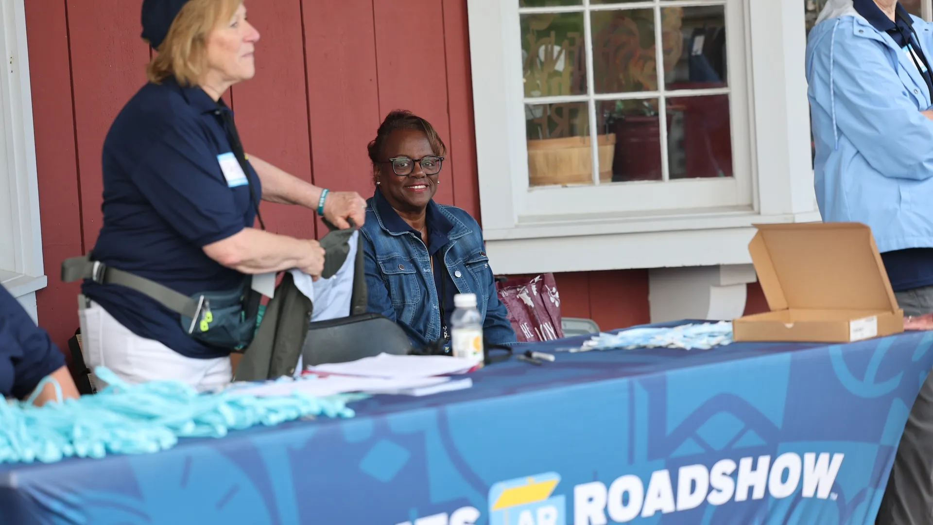 A photo of volunteers at the check in booth