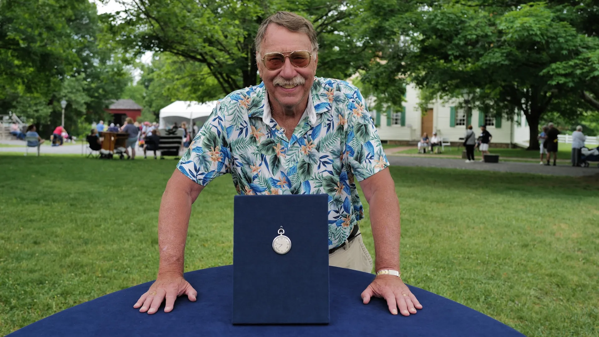 A photo of a guest and a pocket watch