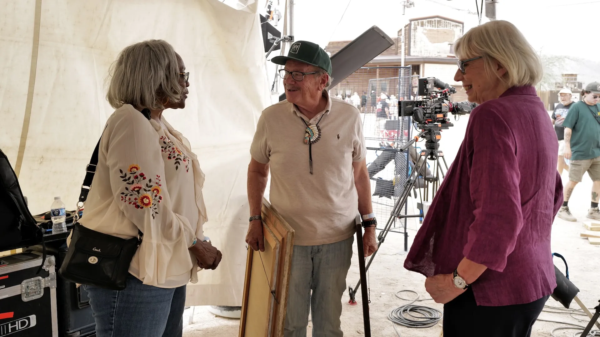 A photo of guests talking to an appraiser