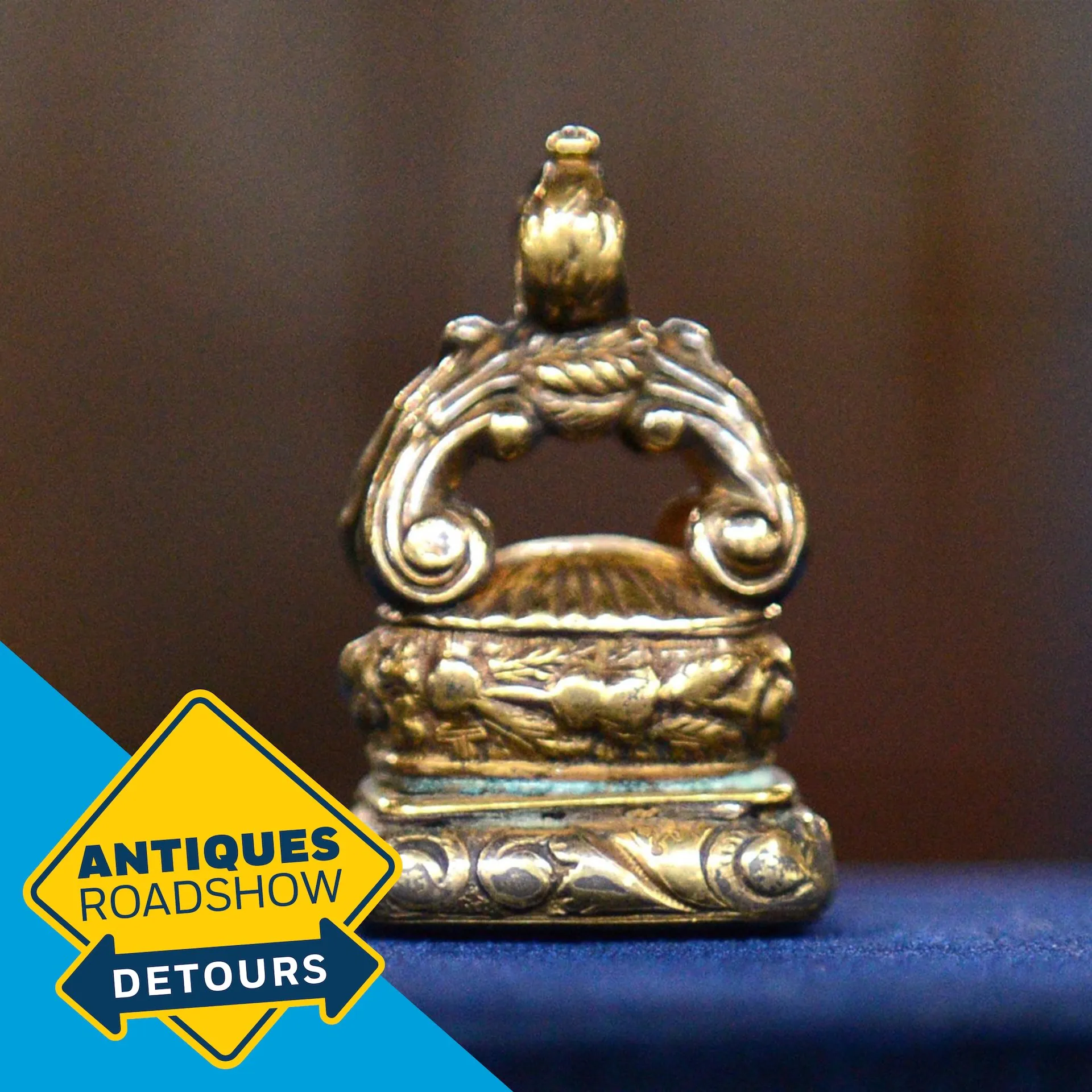 Color Detours podcast graphic of a close-up photograph of gold antique seal