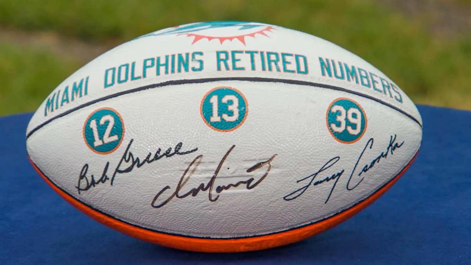 A Dolphins Griese, Marino & Csonka signed football appraised by Jasmani Francis.