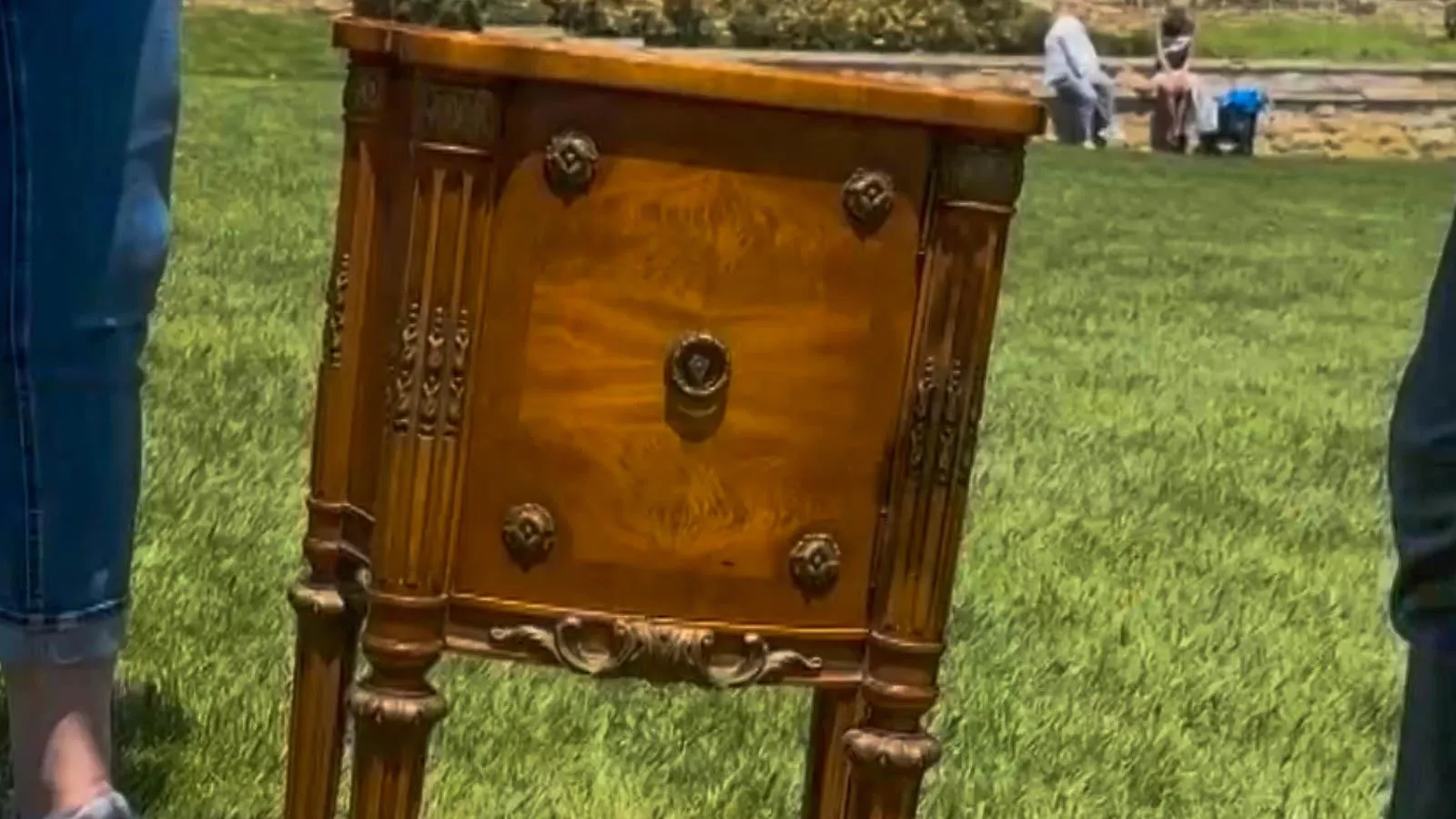 Landstrom Co. Louis XVI-style End Table in light brown wood with five goldish-brown knobs on the front.