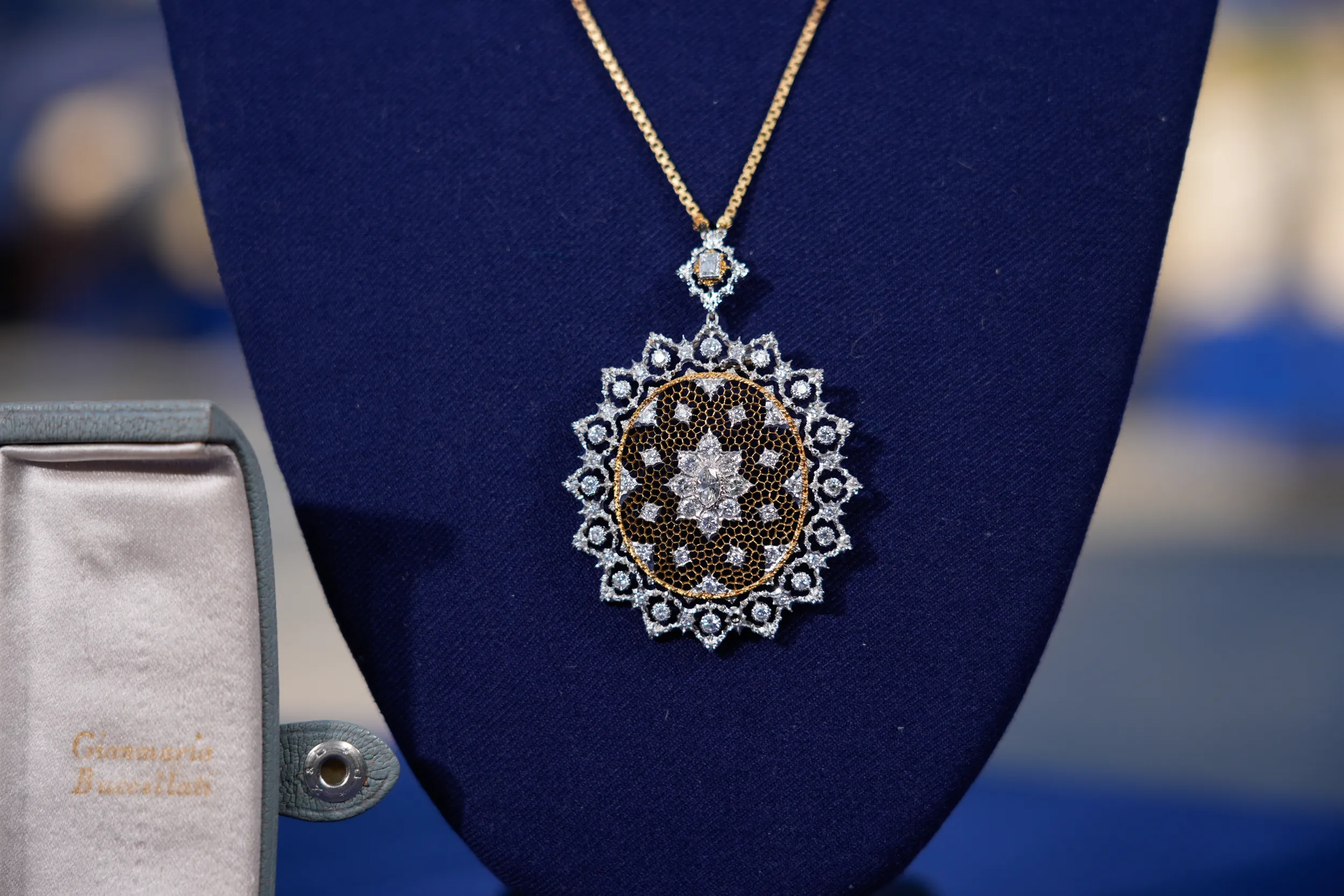 Close-up on a delicate gold and diamond necklace.