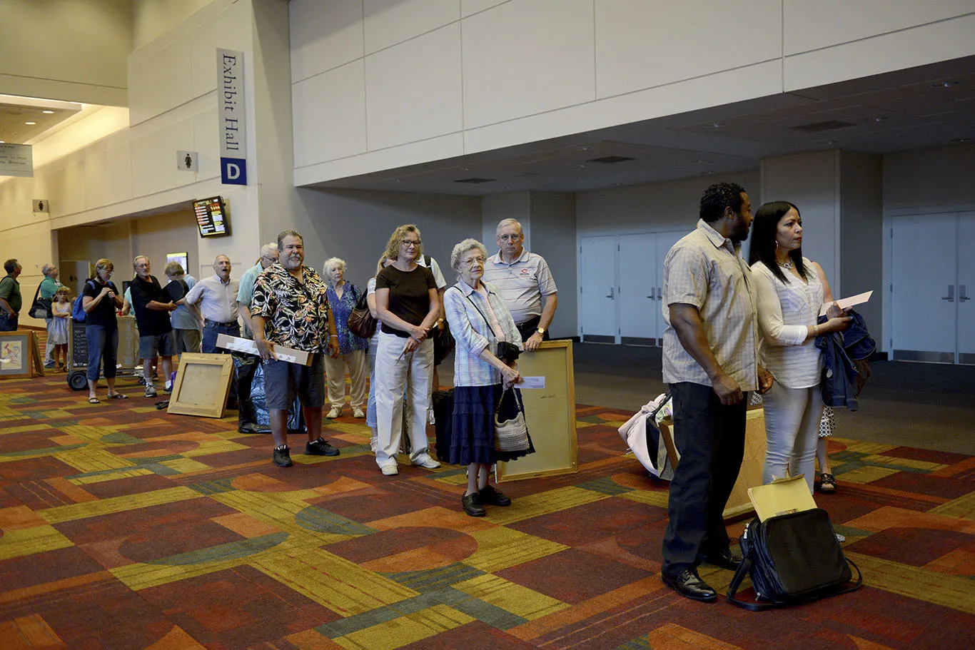 ANTIQUES ROADSHOW guests check in, eager to have their items appraised in Indianapolis, Indiana.
