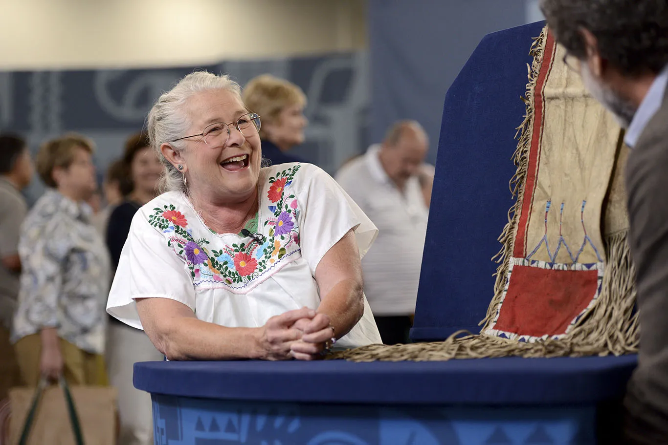 An ANTIQUES ROADSHOW guest is excited to have her item appraised at the June 25th appraisal event in Virginia Beach, Virginia.