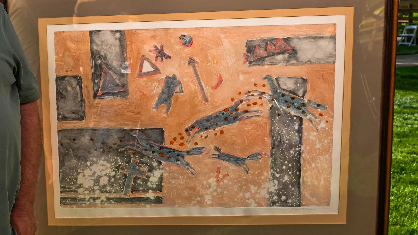 Large framed poster with an abstract foreground and orange background. Scene depicted includes five rectangular shapes and various figures.