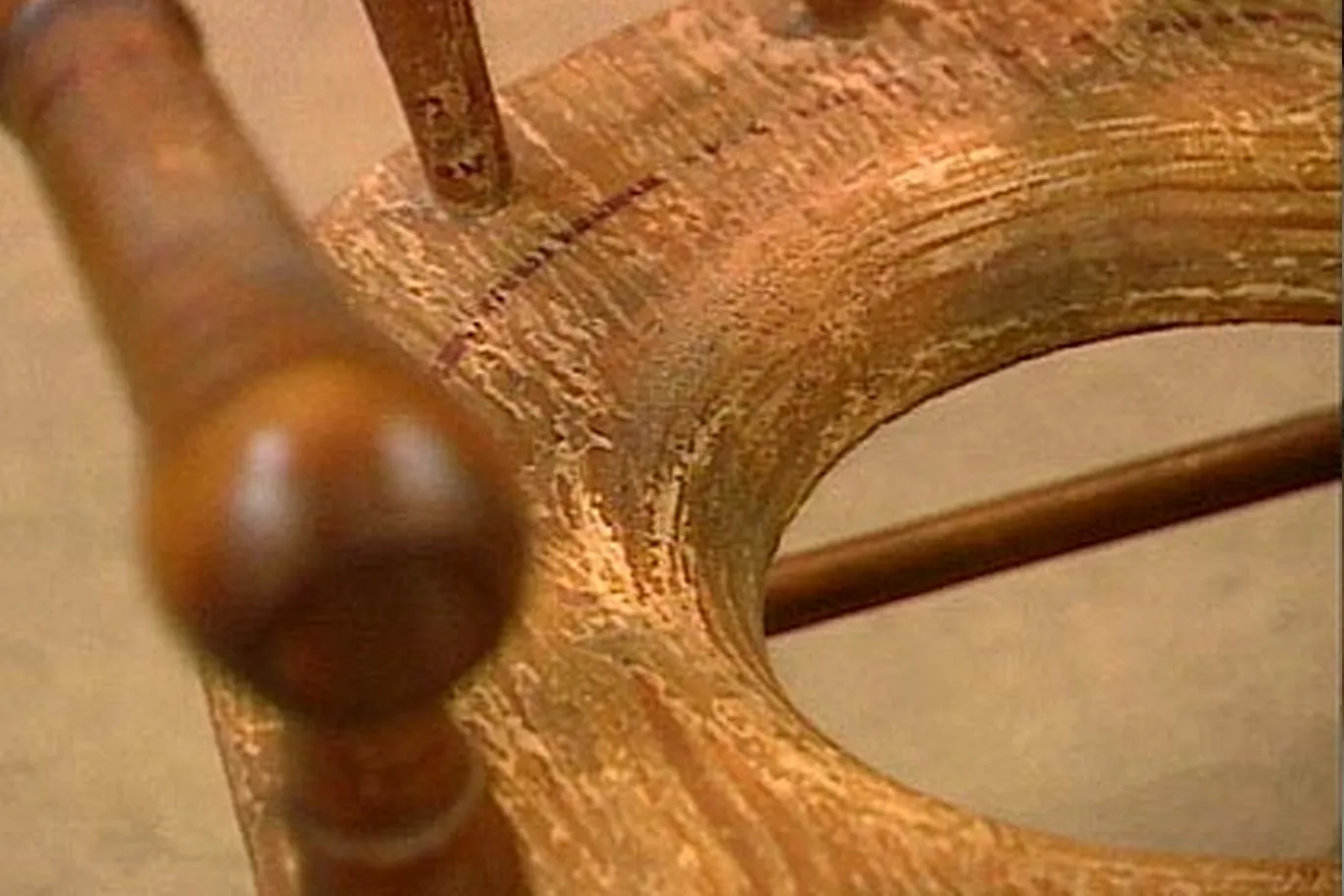 A 19th-century child's potty chair with faded paint.